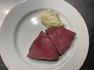  Lean Wagyu steak served without sauce on white plate