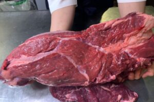 Close-up of Kumamoto Akaushi lean Wagyu steak showcasing vibrant red color and fine texture