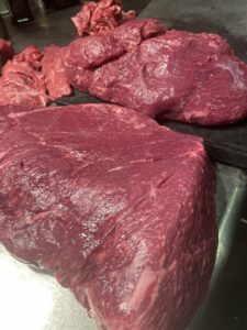 Close-up of Kumamoto Akaushi lean Wagyu beef served at QUNIOMI in Tokyo