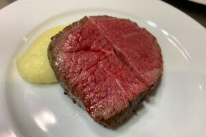 Lean Kumamoto Akaushi Wagyu steak served in Tokyo on a white plate 