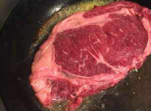 Rare lean Wagyu steak from Kumamoto being pan-seared