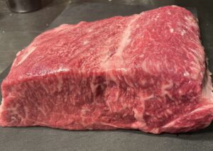 A thick cut of highly marbled Wagyu beef – typical image of luxury beef in Japan 