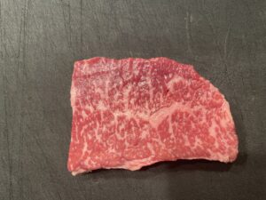 Akaushi Wagyu from Kumamoto – lean beef with subtle marbling, known for its rare status and balanced flavor.