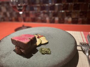 Plated Wagyu course at QUNIOMI in Tokyo, served with seasonal vegetables and wasabi