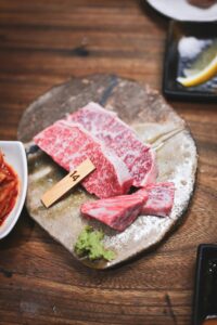 Grilled lean Wagyu steak served with seasonal vegetables on a modern plate 